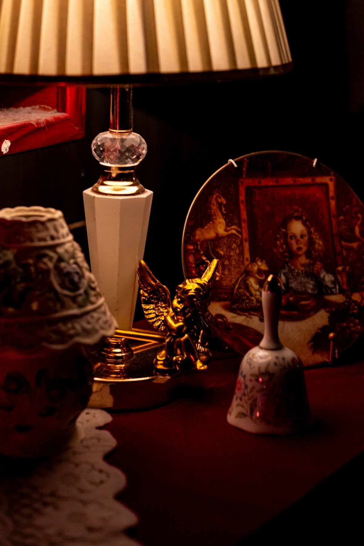 Decorative objects on a table with a lamp
